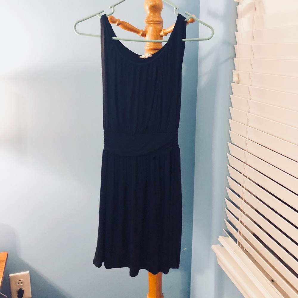 Black sleeveless dress with fitted waist